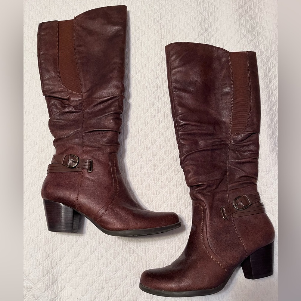 Bare traps tall brown boots